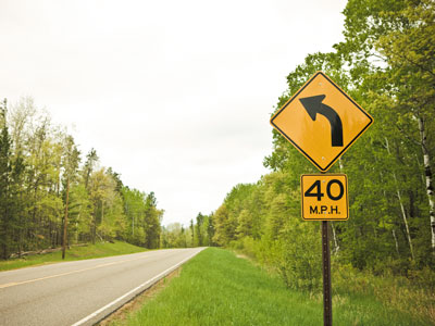 Road sign for sharp corner