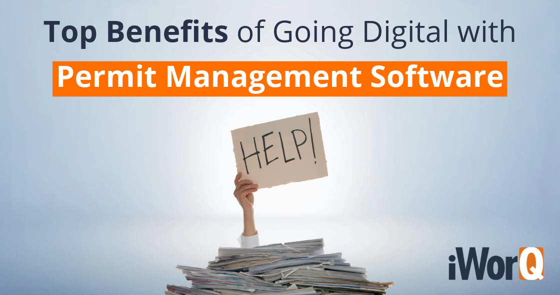 Gray background with iWorQ logo at the top. Title text reads 'Top Benefits of Going Digital with Permit Management Software.' A person holds a help sign above a stack of papers on their desk, highlighting the need for digital solutions.