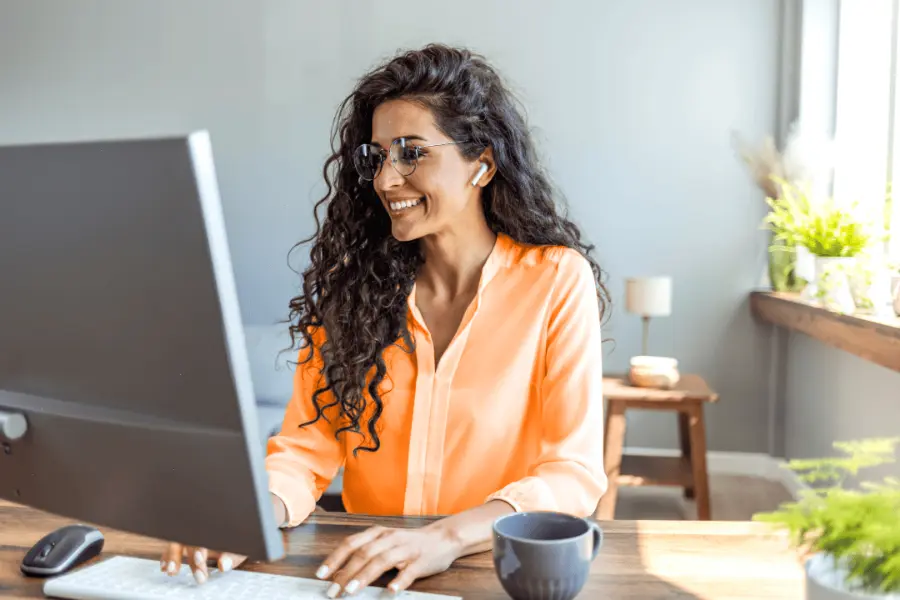 Depiction of a local government worker reviewing an application for a building permit that was submitted online.